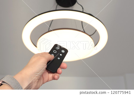 LED ceiling light with smart remote control. Energy saving. Clean planet and environmental protection. LED ceiling light with smart remote control. Energy saving. Clean planet and environmental protection. 120775941