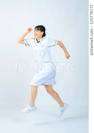 Jumping woman in white coat, nurse, doctor, full body photo Jumping woman in white coat, nurse, doctor, full body photo 120776171
