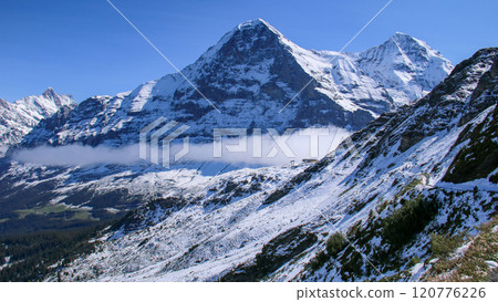 View of the Eiger and Mönch from the Mannliffen trekking trail, Grindelwald, Switzerland View of the Eiger and Mönch from the Mannliffen trekking trail, Grindelwald, Switzerland 120776226