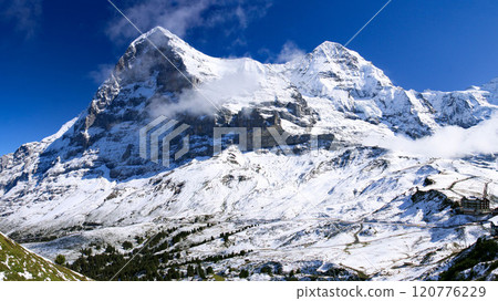 View of the three peaks of Jungfrau from the Mannliffen trekking trail, Grindelwald, Switzerland View of the three peaks of Jungfrau from the Mannliffen trekking trail, Grindelwald, Switzerland 120776229