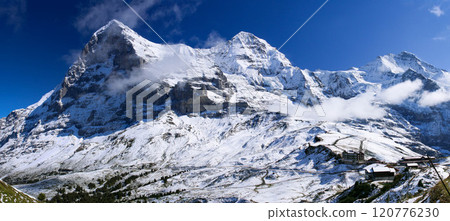 View of the three peaks of Jungfrau from the Mannliffen trekking trail, Grindelwald, Switzerland View of the three peaks of Jungfrau from the Mannliffen trekking trail, Grindelwald, Switzerland 120776230