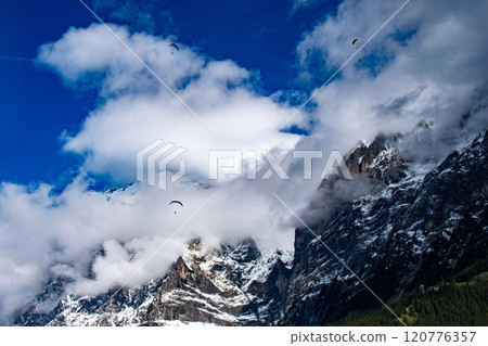 View of the Bernese Alps from the village of Grindelwald, Grindelwald, Switzerland View of the Bernese Alps from the village of Grindelwald, Grindelwald, Switzerland 120776357