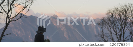landscape and travel concept with asian man relax see sunset camping tent on mountain landscape and travel concept with asian man relax see sunset camping tent on mountain 120776894