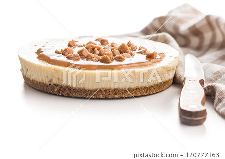 Cheesecake with caramel topping isolated on white background. 120777163