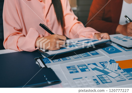 Young Asian business creative team work together, mobile application software design project. Brainstorm meeting, internet technology, smartphone web app designer, office coworker teamwork concept 120777227