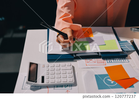 Young Asian business creative team work together, mobile application software design project. Brainstorm meeting, internet technology, smartphone web app designer, office coworker teamwork concept Young Asian business creative team work together, mobile application software design project. Brainstorm meeting, internet technology, smartphone web app designer, office coworker teamwork concept 120777237