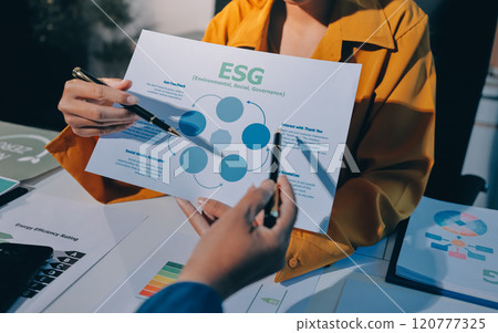 ESG environmental social governance display on laptop on eco-friendly company meeting with business people implementing environmental protection for clean and sustainable future ecology. Trailblazing 120777325