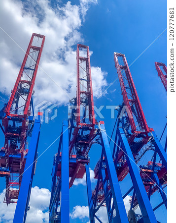 Container cranes against blue sky. High quality photo Container cranes against blue sky. High quality photo 120777681