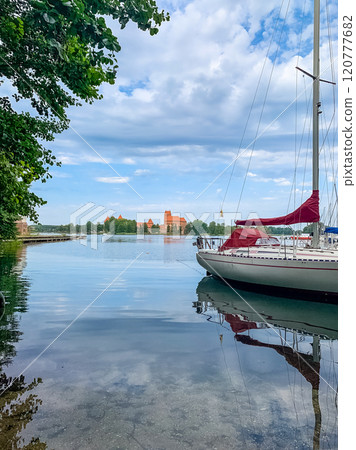 yacht on lake with castle in background . High quality photo yacht on lake with castle in background . High quality photo 120777682