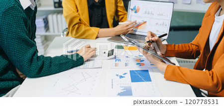 Team business meeting presentation. Hand businessman working project in modern office.Laptop computer and tablet and smart phone Team business meeting presentation. Hand businessman working project in modern office.Laptop computer and tablet and smart phone 120778531