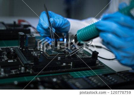 killed hands repairing electronic devices with precision. technology repair, technician expertise, and modern electronic maintenance. 120778759