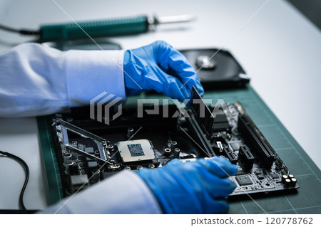 killed hands repairing electronic devices with precision. technology repair, technician expertise, and modern electronic maintenance. 120778762