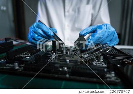 killed hands repairing electronic devices with precision. technology repair, technician expertise, and modern electronic maintenance. 120778767