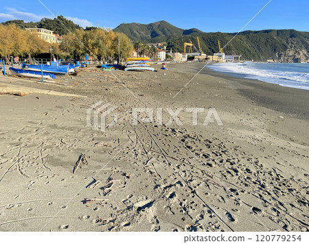Sand and beach on the Mediterranean Sea. Traditional boats and buildings in fishing town of Riva Trigosa, Italy. Sand and beach on the Mediterranean Sea. Traditional boats and buildings in fishing town of Riva Trigosa, Italy. 120779254
