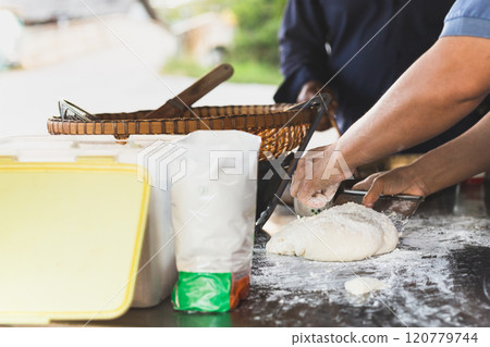Hand baker kneading dough Hand baker kneading dough 120779744
