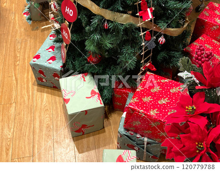 Presents at the base of the Christmas tree (wood grain) Presents at the base of the Christmas tree (wood grain) 120779788