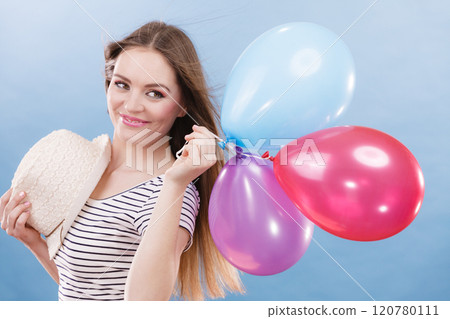 Woman summer joyful girl with colorful balloons 120780111