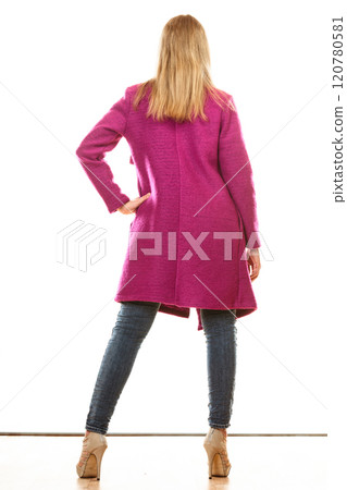 blonde fashionable woman in vivid color coat. 120780581