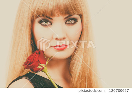 Woman gorgeous girl dark makeup holds rose flower 120780637