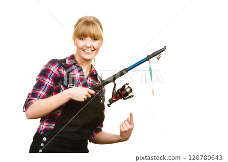Similing woman wearing check shirt holding fishing rod 120780643
