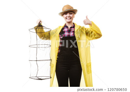 Happy woman holding empty fishing keepnet 120780650