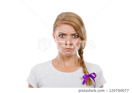 Teenage girl in braid hair making angry face 120780677