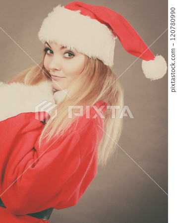 Happy woman wearing Santa Claus helper costume Happy woman wearing Santa Claus helper costume 120780990