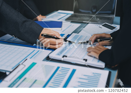 Fund managers team consultation and discuss about analysis Investment stock market at office 120782452