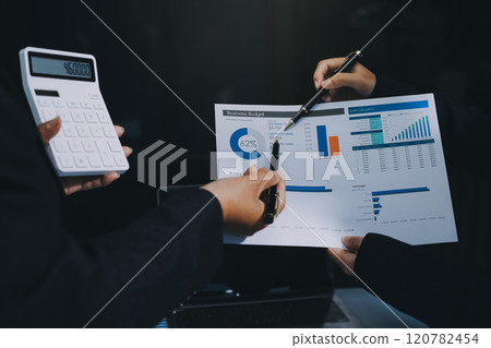 Fund managers team consultation and discuss about analysis Investment stock market at office 120782454