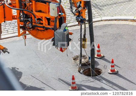 Pipe hose sewage truck car engine emptying city street sewerage manhole. Septic cleaning vacuum service maintenance technology equipment industry. Suction vehicle cleaner machine pumping drainage Pipe hose sewage truck car engine emptying city street sewerage manhole. Septic cleaning vacuum service maintenance technology equipment industry. Suction vehicle cleaner machine pumping drainage 120782816