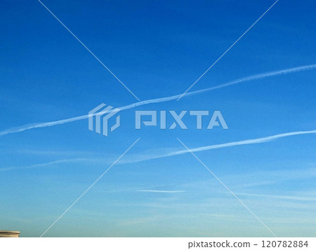 Blue Sky With Aeroplane condensation trails Contails in White Smoke for Background 120782884