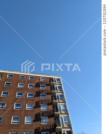 Top Floors of a Highrise Council Block of Flats with Blue Sky 120782894