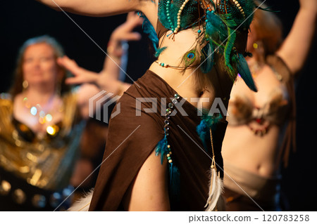 Unrecognizable women dancing oriental belly dance. 120783258