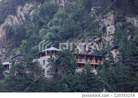 An old-style hotel house was built in the mountains. 120783259