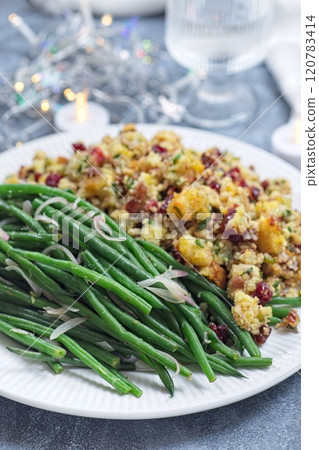 Green beans with caramelized shallots and Traditional Cranberry pecan cornbread dressing, vertical Green beans with caramelized shallots and Traditional Cranberry pecan cornbread dressing, vertical 120783414