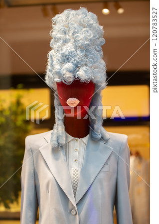 Creative female mannequin in a high retro wig and protruding rag lips. A mixture of centuries and styles. Creative female mannequin in a high retro wig and protruding rag lips. A mixture of centuries and styles. 120783527