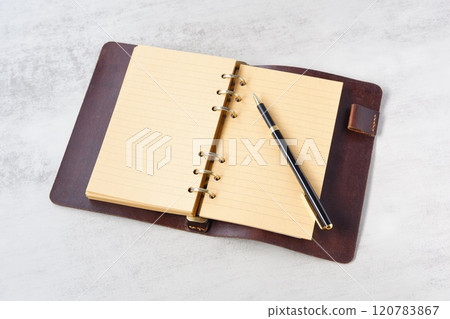 Image of a ring-type system organizer open while doing desk work Image of a ring-type system organizer open while doing desk work 120783867