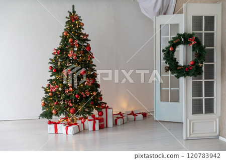 Christmas tree with gifts, toys, garlands, white interior for the new year 120783942
