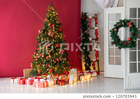 Christmas tree with gifts, toys, garlands, red interior for the new year 120783943