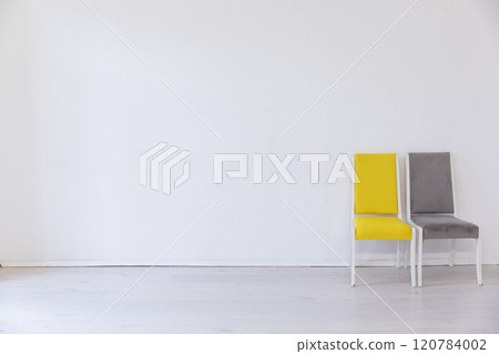 Two vintage chair in the interior of an empty room Two vintage chair in the interior of an empty room 120784002
