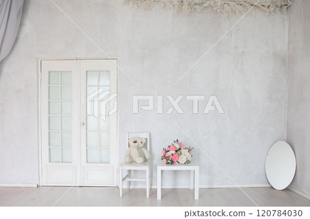mirror, table and chair in the interior of an empty white room mirror, table and chair in the interior of an empty white room 120784030