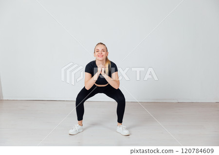 Beautiful athletic woman doing fitness exercises Beautiful athletic woman doing fitness exercises 120784609