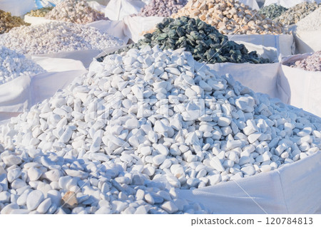 Dolomite mineral stones are sold in construction market. White materials for decoration and construction. Dolomite mineral stones are sold in construction market. White materials for decoration and construction. 120784813
