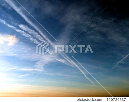 Blue Skys With Aeroplane condensation trails Contails in White Smoke for Background 120784887