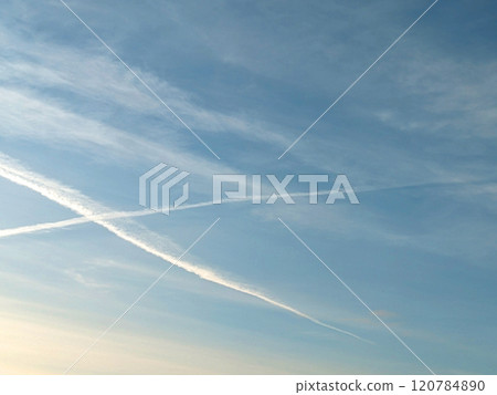 Blue Skys With Aeroplane condensation trails Contails in White Smoke for Background 120784890