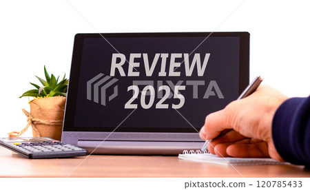 Planning review 2025 new year symbol. Concept words Review 2025 on beautiful black tablet. Beautiful white background. Businessman hand. Business review 2025 new year concept. Copy space. 120785433