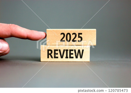 Planning 2025 review new year symbol. Concept words 2025 Review on beautiful wooden blocks. Beautiful grey background. Businessman hand. Business 2025 review new year concept. Copy space. Planning 2025 review new year symbol. Concept words 2025 Review on beautiful wooden blocks. Beautiful grey background. Businessman hand. Business 2025 review new year concept. Copy space. 120785473