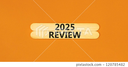 Planning 2025 review new year symbol. Concept words 2025 Review on beautiful wooden sticks. Beautiful orange background. Business 2025 review new year concept. Copy space. Planning 2025 review new year symbol. Concept words 2025 Review on beautiful wooden sticks. Beautiful orange background. Business 2025 review new year concept. Copy space. 120785482