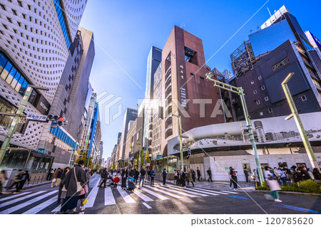 Tokyo cityscape in Japan, December. Ginza Hokoten is crowded with foreign tourists. Redevelopment continues, San-ai is demolished, and four other areas are being redeveloped. 120785620