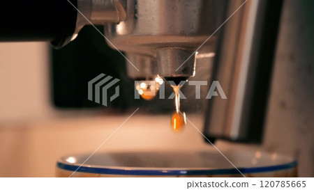 Espresso coffee machine in action, macro shot. Preparing a cup of coffee 120785665